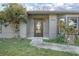 Modern front door with glass panels and a neutral color palette at 3164 Chamberlain St, Deltona, FL 32738