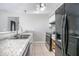 Updated kitchen with stainless steel appliances and granite countertops at 3164 Chamberlain St, Deltona, FL 32738