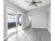 Bright living area with sliding glass doors leading to a screened patio at 3164 Chamberlain St, Deltona, FL 32738