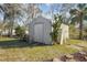 Large storage shed with a ramp and mature landscaping at 3164 Chamberlain St, Deltona, FL 32738