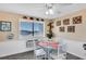 Charming dining area with a small table and chairs, beachy decor at 3509 S Atlantic Ave # 301, New Smyrna Beach, FL 32169