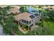 Two-story house with solar panels and a lake view at 3548 Tuscany Reserve Blvd, New Smyrna Beach, FL 32168