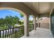Covered balcony overlooking the community with beautiful landscaping at 3548 Tuscany Reserve Blvd, New Smyrna Beach, FL 32168