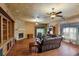 Finished basement with a stone fireplace and leather seating at 3548 Tuscany Reserve Blvd, New Smyrna Beach, FL 32168