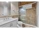 Well-maintained bathroom features a glass-enclosed shower, single vanity with cabinet, and tiled walls, perfect for relaxation at 3548 Tuscany Reserve Blvd, New Smyrna Beach, FL 32168