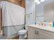 Clean bathroom with white vanity, shower/tub combo and tile floors at 3548 Tuscany Reserve Blvd, New Smyrna Beach, FL 32168