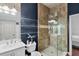 Stylish bathroom boasts a glass walk-in shower, a vanity with ample storage, and modern fixtures, creating a luxurious feel at 3548 Tuscany Reserve Blvd, New Smyrna Beach, FL 32168