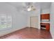 Bright bedroom with wood floors, built-in desk and double closet at 3548 Tuscany Reserve Blvd, New Smyrna Beach, FL 32168