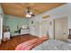 Spacious bedroom with wood floors and plenty of natural light at 3548 Tuscany Reserve Blvd, New Smyrna Beach, FL 32168