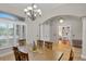 Spacious dining room with a chandelier and hardwood floors at 3548 Tuscany Reserve Blvd, New Smyrna Beach, FL 32168