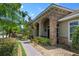 Brick walkway leading to a covered entry with double doors at 3548 Tuscany Reserve Blvd, New Smyrna Beach, FL 32168