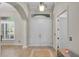 Inviting entryway featuring a double door, tile flooring with decorative border, and decorative lighting at 3548 Tuscany Reserve Blvd, New Smyrna Beach, FL 32168