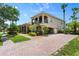 Two-story home with a large driveway and lush landscaping at 3548 Tuscany Reserve Blvd, New Smyrna Beach, FL 32168
