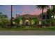 Two-story house with a tile roof, landscaping, and a walkway at 3548 Tuscany Reserve Blvd, New Smyrna Beach, FL 32168