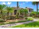 House with palm trees and a brick walkway at 3548 Tuscany Reserve Blvd, New Smyrna Beach, FL 32168