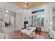 Spacious home office with hardwood floors and view into dining area at 3548 Tuscany Reserve Blvd, New Smyrna Beach, FL 32168