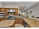Eat-in kitchen features stainless steel appliances and granite countertops at 3548 Tuscany Reserve Blvd, New Smyrna Beach, FL 32168