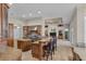 Island kitchen features stainless steel appliances and breakfast bar at 3548 Tuscany Reserve Blvd, New Smyrna Beach, FL 32168