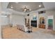 Spacious living room featuring a tile floor, built-in entertainment center, and comfortable seating at 3548 Tuscany Reserve Blvd, New Smyrna Beach, FL 32168