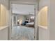 View of main bedroom from hallway, featuring hardwood floors and large windows at 3548 Tuscany Reserve Blvd, New Smyrna Beach, FL 32168