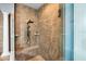 Large walk-in shower with tiled walls and built-in seat at 3548 Tuscany Reserve Blvd, New Smyrna Beach, FL 32168