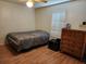 Guest bedroom with a double bed and a dresser at 3566 Red Pontiac Dr, Port Orange, FL 32129
