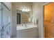 Bathroom with vanity, large mirror, and a walk-in shower at 3605 Galway Ln, Ormond Beach, FL 32174