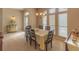 Bright dining room featuring a formal table and hardwood floors at 3605 Galway Ln, Ormond Beach, FL 32174