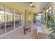 Spacious screened porch with seating and glass sliding doors at 3605 Galway Ln, Ormond Beach, FL 32174