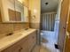 Clean bathroom with double vanity and shower/tub combo at 3669 General Marshall Rd, Daytona Beach, FL 32124