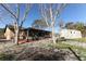 View of backyard, shed, and screened porch at 405 Dumont Ave, Deltona, FL 32738