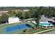 A stunning aerial view of a community pool and tennis court, perfect for active residents at 419 Still Forest Ter, Sanford, FL 32771