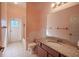 Cozy bathroom featuring a shower-tub combo, granite vanity top, and a large mirror with ample lighting at 419 Still Forest Ter, Sanford, FL 32771