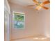 Bright bedroom featuring a ceiling fan and a window that offers natural light and a peaceful atmosphere at 419 Still Forest Ter, Sanford, FL 32771