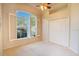 Bright bedroom with plush carpeting, a large window, and a spacious closet at 419 Still Forest Ter, Sanford, FL 32771