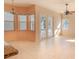 Cozy dining area featuring tile floors, a modern ceiling fan, and French doors to the outdoor space at 419 Still Forest Ter, Sanford, FL 32771