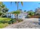 Charming single-story home with a gray facade, a well-kept lawn, and a paved driveway at 419 Still Forest Ter, Sanford, FL 32771