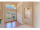 Bright foyer features tile flooring, decorative window, and a double-door entryway, creating an inviting ambiance at 419 Still Forest Ter, Sanford, FL 32771