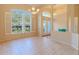Bright living room with tile flooring, large window with shutters, and neutral paint throughout the home at 419 Still Forest Ter, Sanford, FL 32771