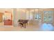 Open-concept living area with tile flooring, archways, and large windows for plenty of natural light at 419 Still Forest Ter, Sanford, FL 32771