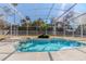 Inviting screened-in pool and spa provides a private outdoor oasis, great for entertaining and relaxation at 419 Still Forest Ter, Sanford, FL 32771