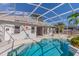 Backyard oasis featuring a sparkling pool, screened enclosure, and tastefully decorated exterior walls at 419 Still Forest Ter, Sanford, FL 32771