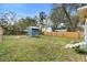 Large backyard with storage shed and wooden fence at 448 E Church St, Deland, FL 32724