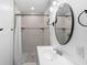 Updated bathroom with walk-in shower and modern vanity at 448 E Church St, Deland, FL 32724
