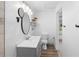 Bathroom with vanity, toilet, and access to backyard at 448 E Church St, Deland, FL 32724