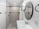 Updated bathroom with walk-in shower and modern vanity at 448 E Church St, Deland, FL 32724