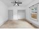 Bedroom featuring carpet, ceiling fan and closet at 448 E Church St, Deland, FL 32724