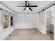 Bright bedroom with carpet, ceiling fan, and barn door at 448 E Church St, Deland, FL 32724