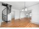 Dining room adjacent to spiral staircase and hardwood floors at 448 E Church St, Deland, FL 32724