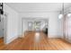 Bright dining room with hardwood floors and view of living room at 448 E Church St, Deland, FL 32724